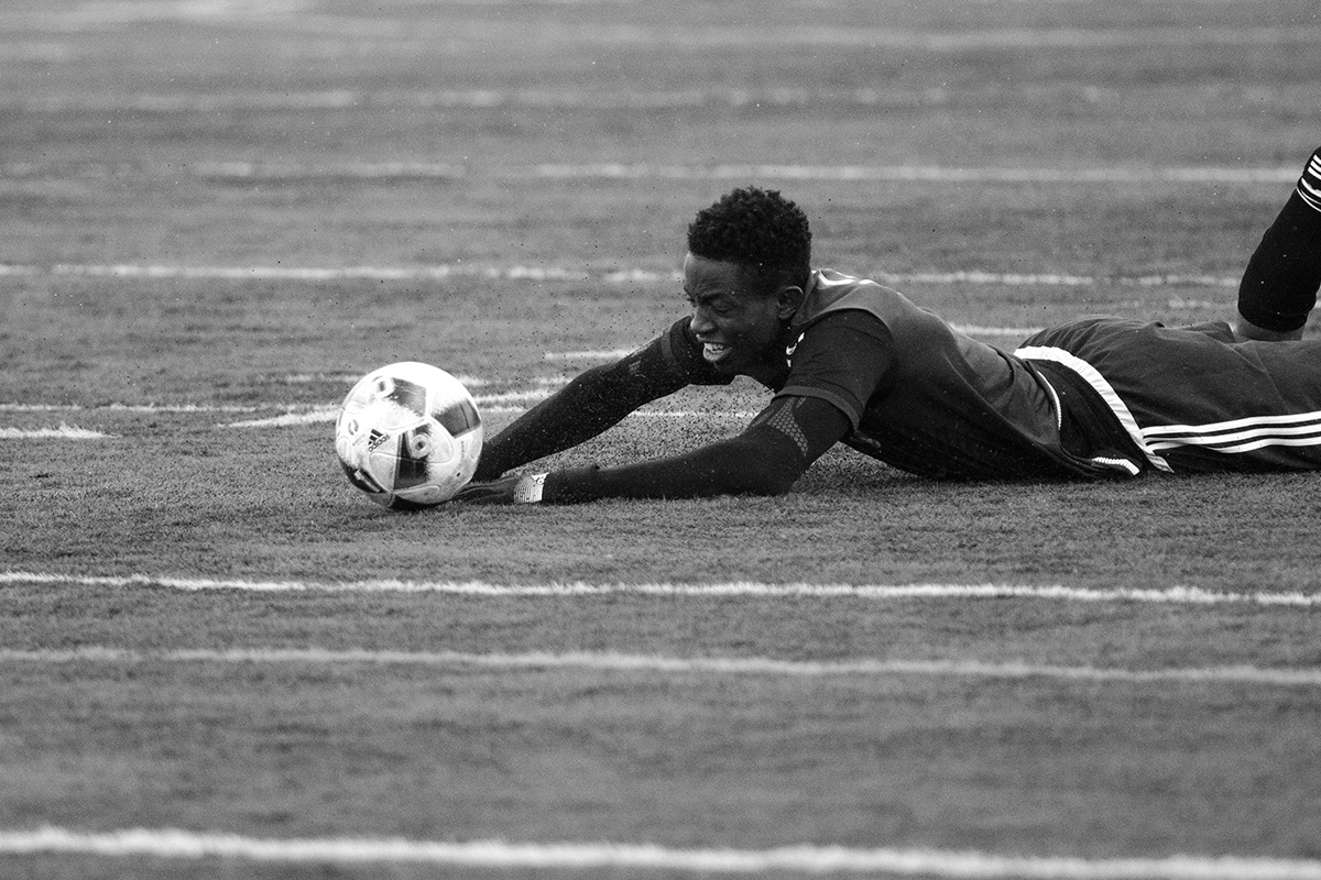 Tolu Esan dives for the ball