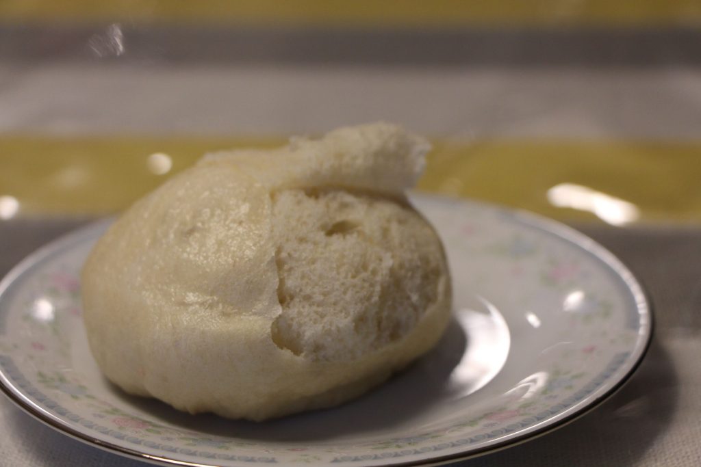 Peeling the skin of the red bean bun