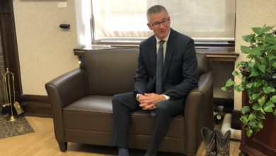 Minister of Finance shows off old shoes prior to budget release