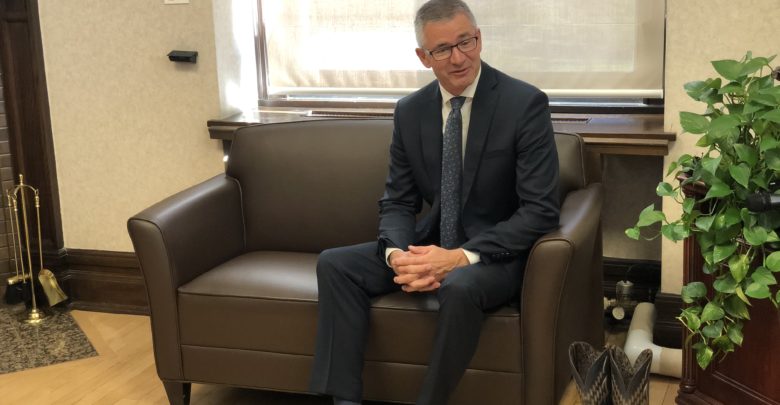 Minister of Finance shows off old shoes prior to budget release