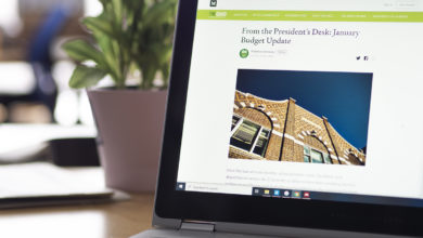 laptop screen open on table