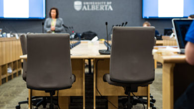 2 chairs in front of a large table