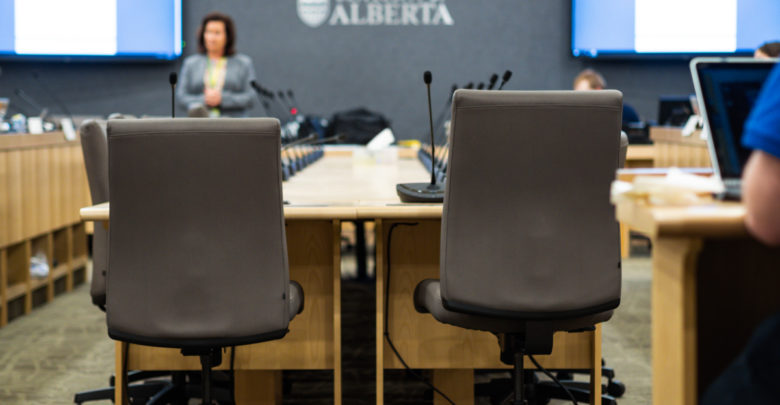 2 chairs in front of a large table
