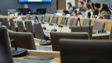 microphones and chairs in a council chamber