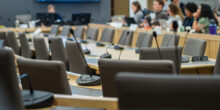 microphones and chairs in a council chamber