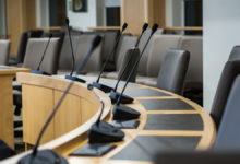 microphones and chairs in a council chamber