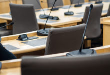microphones and chairs in a council chamber
