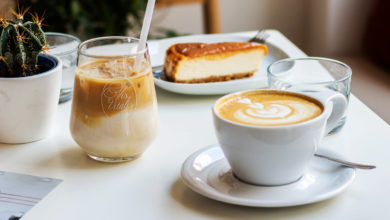 iced coffee and hot coffee sitting on table