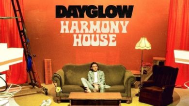 Man in suit sitting on a couch