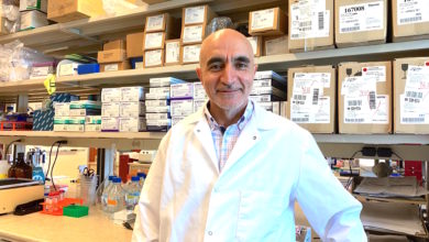 Man in lab coat standing in science lab