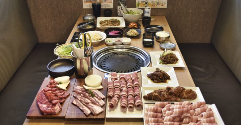 The table layout at Baekjeong Korean BBQ House. It's the combo for 4, with plenty of meat.