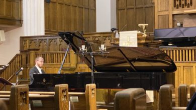 A photo of Nicolas Namoradze at the piano, performing for the ECMS.