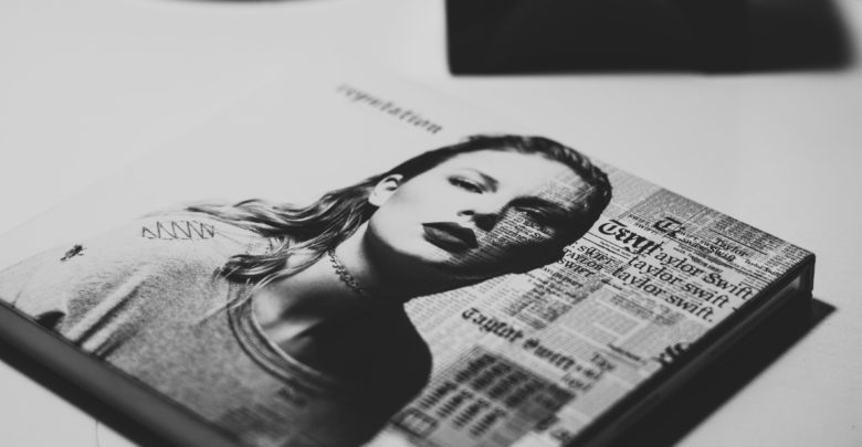 A photo of a black-and-white Taylor Swift album.