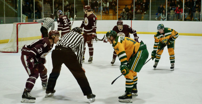 The Golden Bears and Griffins face off in a hockey game on December 4, 2021.