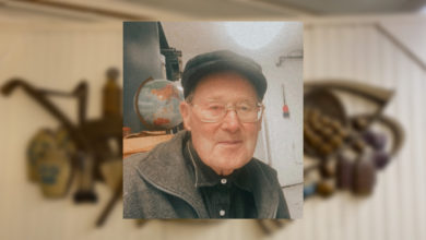 A photo of Jack Francis against the backdrop of a photo of the museum.
