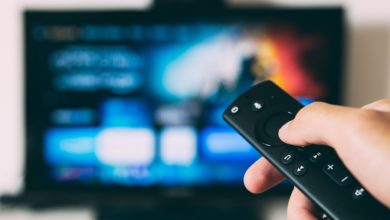 Someone is pointing a remote control at the television, Glenn Carstens-Peters credit on Unsplash