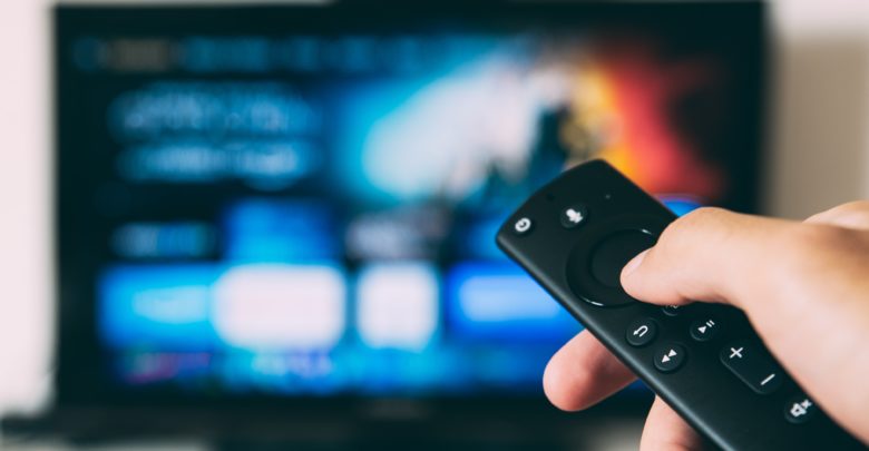 Someone is pointing a remote control at the television, Glenn Carstens-Peters credit on Unsplash