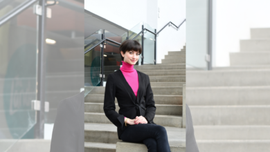 Samantha Gardner sits on a staircase