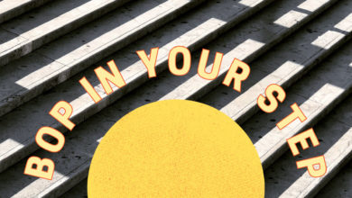 A half sun sits in the centre of the photo with curved "bop in your step" text curved around it. Background image is by Martino Pietropoli on Unsplash.