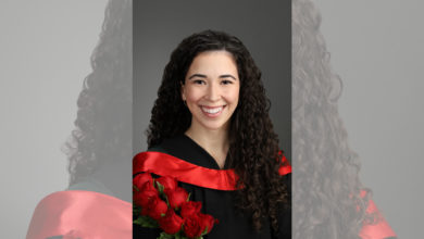 Rielle Gagnon in a graduation gown with roses