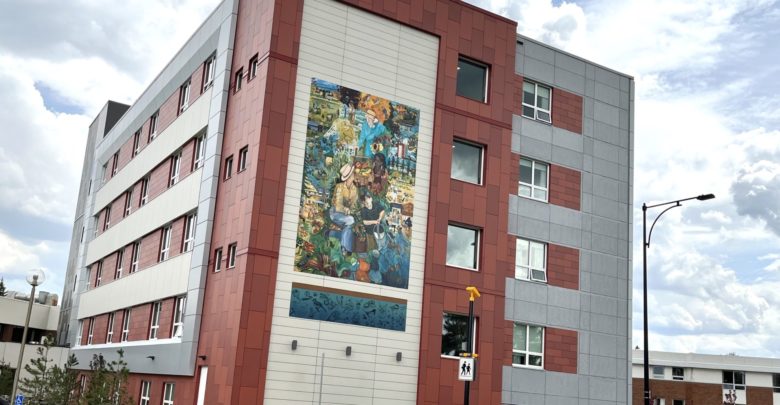 The outside of the Canterbury Cares building showing the mural