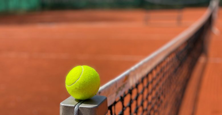 Photo by: matthias david, a stock image of a tennis court and a tennis ball
