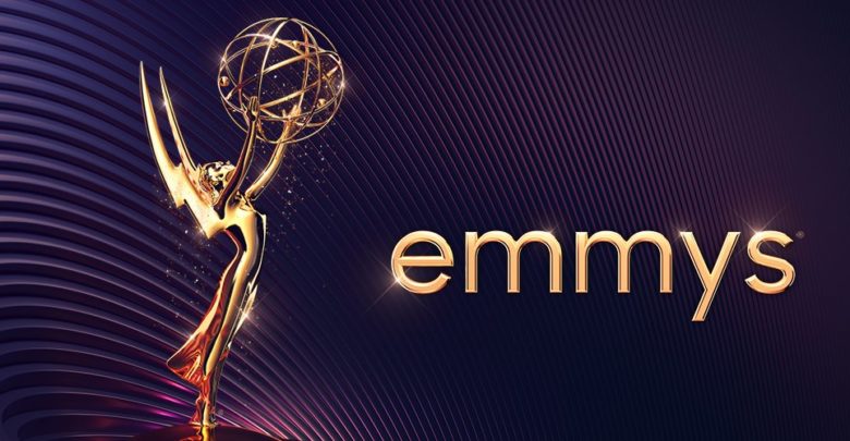 A graphic of the classic Emmys award. The background is mostly dark purple with a minimalistic metallic circular pattern. The text "emmys" is displayed next to the award in a minimal sans font. Image taken from the Television Academy's Twitter page.