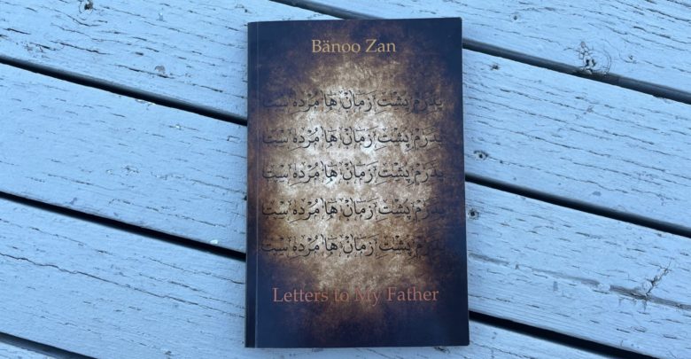 Banoo Zan's Letters to My Father book cover, placed on top of a wooden deck