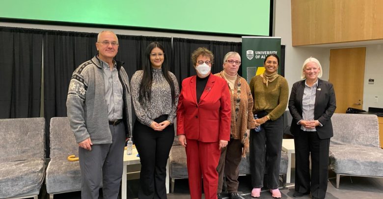 Isha Datar, Ellen Goddard, William Shotyk, Gleise M. Silva, and Alison Sunstrum standing in a line at the University of Alberta's Chancellor Food Forum.