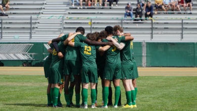 Bears soccer team huddle, photo by Martin Bendico