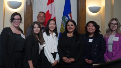 Rajan Sawhney, third from the right, pictured with student leaders at a reception.