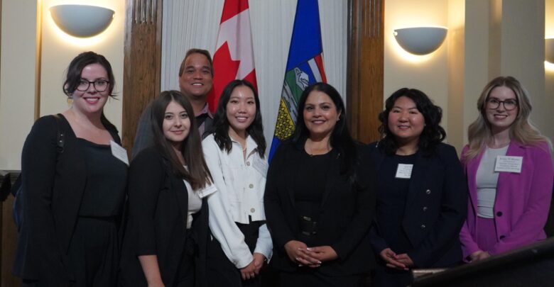 Rajan Sawhney, third from the right, pictured with student leaders at a reception.